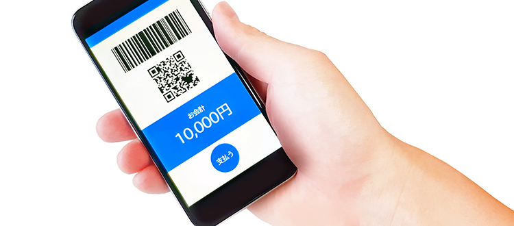 ツケ払いアプリの画面を映したスマートフォン